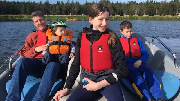 Philip Murphy with son Brendan (6), Clara (14) and Felipe (12), enjoying a family boating excursion.