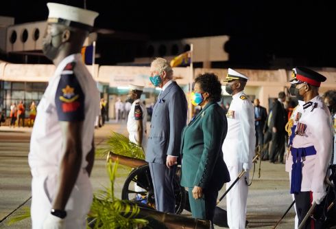 NEW REPUBLIC: The Prince of Wales observes a gun salute, standing alongside Sandra Mason, the former governor-general and President-elect of Barbados, at Grantley Adams International Airport, Bridgetown, Barbados. The prince is visiting the Caribbean Island to mark the country's transition to a republic within the Commonwealth. Photograph: Jonathan Brady/PA Wire
