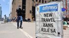  A daily newspaper poster reporting on the recently introduced travel bans  in Harare, Zimbabwe after the outbreak of the Omicron variant of coronavirus in South Africa and Botswana. Photograph: Aaron Ufumeli/EPA