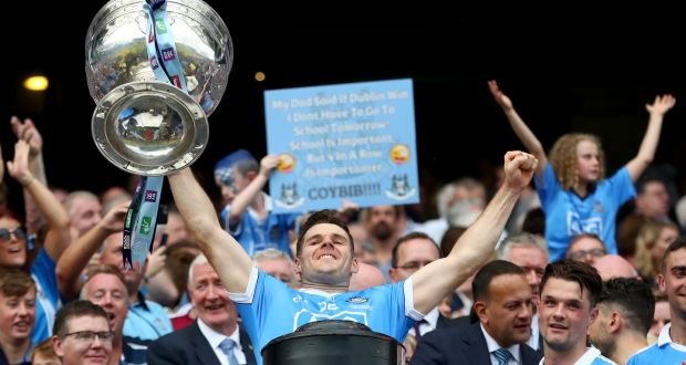 Kevin McManamon lifts Sam Maguire in 2018. Photograph: James Crombie/Inpho
