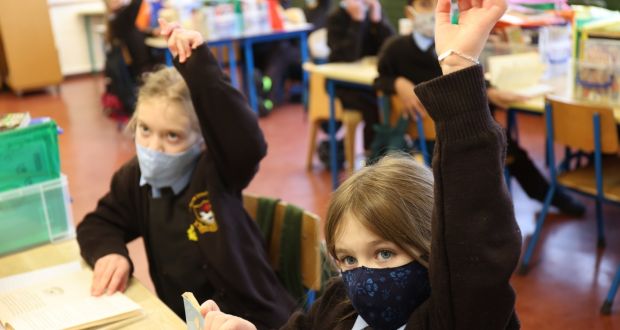 Aleigha Babington-Byrne (right) and Urszula Murek (left) among third class pupils from St Clare’s Primary School in Harold’s Cross, Dublin wearing facemarks in the classroom during lessons on Wednesday.  Photograph: Bryan O’Brien/The Irish Times 