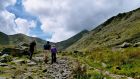 Three people climbing Carrauntoohil, Co Kerry. Photograph: iStock