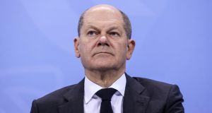 Chancellor-elect Olaf Scholz said he had delivered on his SPD’s key election promises: a €12 minimum wage, higher child allowance and an undertaking to keep pensions stable. Photograph: Filip Singer/Getty Images