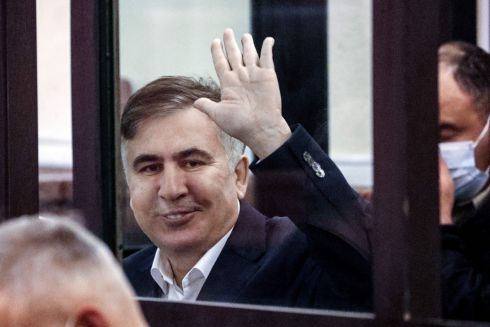 TRIAL: Georgia's former President Mikheil Saakashvili waves from the defendant's box during his trial for his alleged role in a violent police crackdown on an opposition protest in 2007 that was reportedly masterminded by a Kremlin-backed oligarch in order to derail Georgia's bid to join NATO, in Tbilisi on December 2nd. Photograph: Irakli Gedenidze/Pool/AFP via Getty