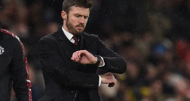Manchester United’s  caretaker manager Michael Carrick checks his watch during the  Premier League  match against Arsenal at Old Trafford. Photohraph:  Oli Scarff/AFP via Getty Images