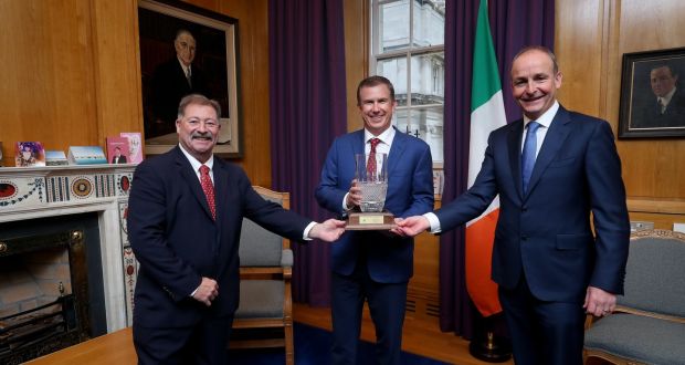 Taoiseach Micheál Martin presenting the Ireland-US Council for Commerce and Industry 2021 Global Achievement Award to Geoff Martha(centre), chief executive of Medtronic, with Tom Higgins, president of the council. The award marked Medtronic’s role in the Covid-19 pandemic for a ramping-up of its ventilator prediction in Galway at the height of the global crisis. Photograph: Maxwell