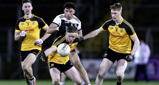 Ramor United’s Jack Brady and Enda Maguire in action against  Dylan Ward of Kilcoo during the AIB Ulster Club Senior Football Championship quarter-final at  Kingspan Breffni Park. Photograph: Laszlo Geczo/Inpho