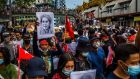 People march in Yangon, Myanmar, in February after the military coup. Five people were killed and at least 15 arrested at a protest there on Sunday morning. Photograph: New York Times