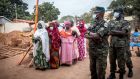Women queue ahead of polls opening in the Gambia’s presidential election. Photograph: Sally Hayden
