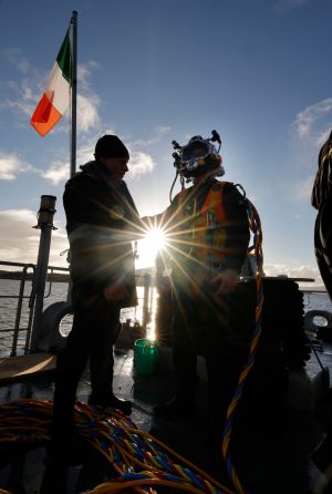 Participants of the 4th Combined Naval Service Diving Section Selection Course  using Surface Supplied Diving Equipment on the deck of the LÉ James Joyce at Bere Island. The Annual Naval Diving course is one of the toughest in the Defence Force with an average 75% failure rate.
Photograph: Alan Betson / The Irish Times


