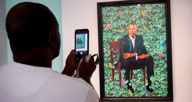 Visitors view the official portrait of former president Barack Obama by Kehinde Wiley at the Art Institute of Chicago on June 18th, 2021. Photograph:  Scott Olson/Getty Images