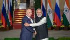 Russia’s president, Vladimir Putin, is greeted by Indian prime minister  Narendra Modi in New Delhi on Monday. Photograph: T Narayan/Bloomberg