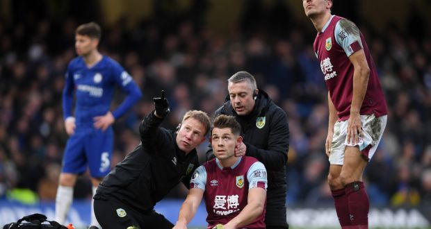 James Tarkowski is assessed for concussion during a Premier League match between Burnley and Chelsea last year. Photo: Mike Hewitt/Getty Images