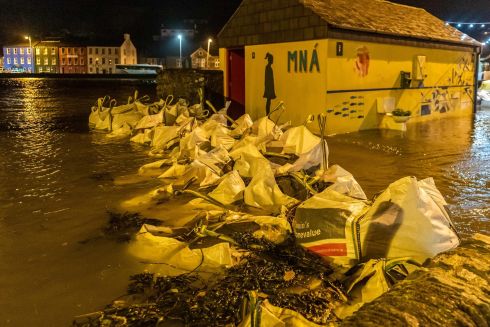 Sandbags are piled up in the Co Cork town of Bantry, which flooded after Storm Barra hit Ireland with disruptive winds, heavy rain and snow. Photograph: Andy Gibson/PA Wire 
