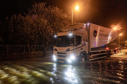 A lorry drives through floodwater in Bantry,  Co Cork. Photograph: Andy Gibson/PA Wire 