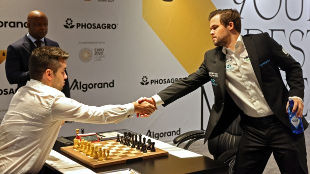Carlsen looks set to retain his title after a mistake by Nepomniachtchi in game eight. Photograph: Giuseppe Cacace/AFP