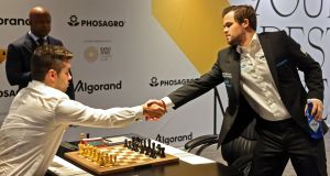 Carlsen looks set to retain his title after a mistake by Nepomniachtchi in game eight. Photograph: Giuseppe Cacace/AFP 