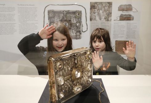 SACRED OBJECT: Ella and Oisin Scarff Higgins, children of National Museum of Ireland director Lynn Scarff, take in the Shrine of Míosach, as the museum launched Colmcille: Sacred Objects of a Saint - 1,500 Years of Devotion, at the National Museum of Ireland Archaeology, Kildare Street, Dublin. Photograph: Julien Behal Photography
