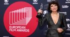 Danish director Susanne Bier poses with her award at the 34th European Film Awards in Berlin on Saturday. Photograph: Christian Mang/AFP via Getty Images