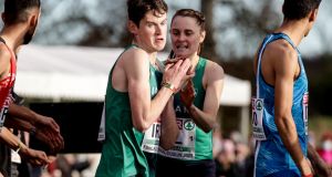 Ireland’s Ciara Mageean passes the baton to Luke McCann in the Mixed 4x1,500m relay. Photograph: Morgan Treacy/Inpho