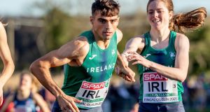 Ireland’s Siofra Cleirigh Buttner with Andrew Coscoran competing in the mixed relay. Photograph: Morgan Treacy/Inpho