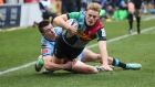 Harlequins’ Louis Lynagh scores a try despite the efforts of Josh Adams of Cardiff during the Heineken Champions Cup game at Twickenham Stoop. Photograph: Billy Stickland/Inpho