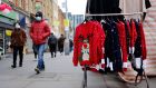 Christmas jumpers on display in a market stall in east London.   A further 91,743 coronavirus cases were recorded in Britain on Monday, with 44 newly reported deaths. Photograph: Tolga Akmen/AFP via Getty Images