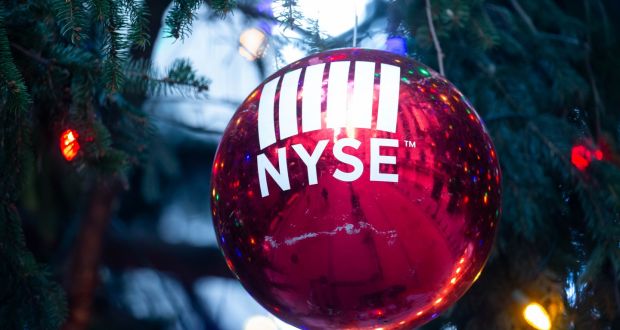 A festive bauble in front of the New York Stock Exchange: the mood was upbeat on stock markets ahead of Christmas. Photograph: Michael Nagle/Bloomberg