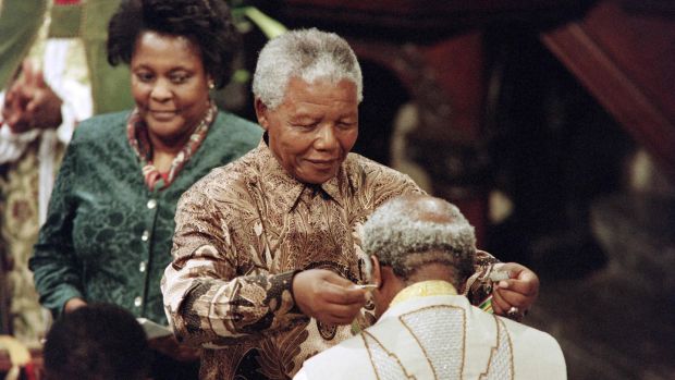 Former South African president Nelson Mandela bestows The Order of Meritorious Service (Gold) on Archbishop Desmond Tutu in 1996. Photograph: Anna Zieminski via Getty
