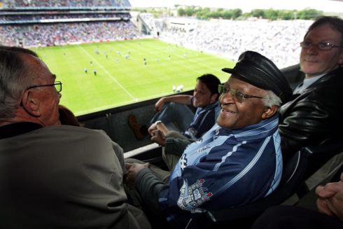 Archbishop Desmond Tutu watching  the Leinster Senior Football Championship match between  Meath and Dublin, at Croke Park, yesterday. The archbishop who arrived in Dublin yesterday, is here to join celebrations marking the 30th anniversary of AFRI.
Photograph: Eric Luke/The Irish Times                     
