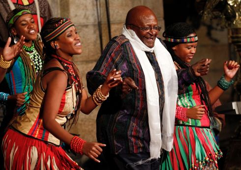 Former South African Anglican Archbishop Desmond (2-R) dances with the Soweto Gospel Choir during the launch of the book 'Tutu: The Authorised Portrait', at the St Georges Cathedral in Cape Town, South Africa 06 October 2011 (reissued 26 December 2021). Desmond Tutu has died aged 90, the South African presidency said on 26 December 2021. As a leading spokesperson for the rights of black South Africans, Tutu in 1984 received the Nobel Prize for Peace for his role in the opposition to apartheid in South Africa. Photograph NIC BOTHMA/EPA
