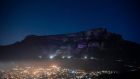 Table Mountain lit up in purple to honour the memory of Archbishop Desmond Tutu, in Cape Town. Photograph: Rodger Bosch/AFP via Getty