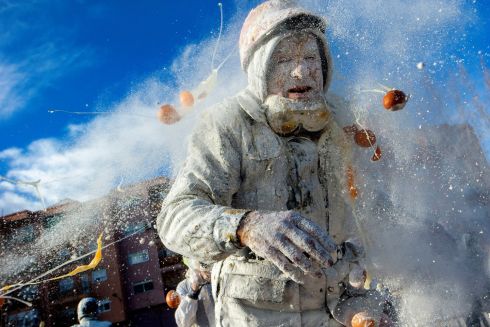 BAKE OUT: A reveller takes part in the Els Enfarinats festival, in the town of Ibi, near Alicante, Spain. For about 200 years the inhabitants of Ibi have annually celebrated with a battle employing flour, eggs and firecrackers, outside the city town hall. Photograph: Alberto Saiz/AP Photo
