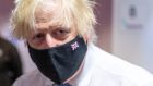 British PM Boris Johnson visits a Covid-19 vaccination centre in Milton Keynes on Wednesday. Photograph: Geoff Pugh/Pool/AFP via Getty Images