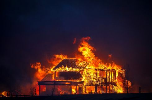 A home burns after a fast-moving wildfire swept through the area in the Centennial Heights neighbourhood of Louisville, Colorado, on Thursday. State officials estimated some 600 homes had already been lost in multiple areas around Boulder County. Photograph: Marc Piscotty/Getty 