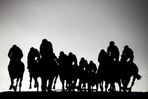 IN SILHOUETTE: Runners and riders in the Keith Casey Memorial Handicap Hurdle at Tramore Racing, Tramore Racecourse, Waterford. Photograph: Morgan Treacy/Inpho
