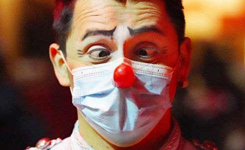 MASK OF A CLOWN: Clown David Marquez wears a face covering as he welcomes patrons to Duffy's Winter Circus at Tallaght Stadium, Dublin. Photograph: Niall Carson/PA Wire
