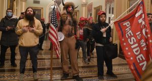 Trump supporters who broke into the Capitol building last January: Barbara F Walter contends that civil wars are most likely to occur in countries in a 'middle ground' between democracy and autocracy known as 'anocracy'. Photograph: Saul Loeb/AFP 