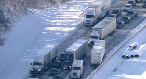 FROZEN SOLID: Motorists stranded on Interstate 95 in Northern Virginia, US. Hundreds of motorists were stranded all night in snow and freezing temperatures along a 50-mile stretch of the highway after a crash involving six tractor-trailers. Photograph: WJLA/AP
