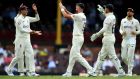 England celebrate after James Anderson took the wicket of Marcus Harris in Sydney. Photograph: Dan Himbrechts/EPA