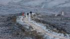 MOUNTAIN SNOW: Winter walkers stroll among ice and snow near Old Military Road in the Dublin Mountains. Photograph: Alan Betson/The Irish Times


