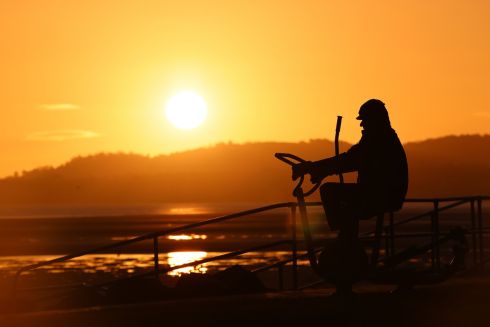 EARLY TO RISE: A person exercises at sunrise in Sandymount, Dublin. Photograph: Dara Mac Dónaill/The Irish Times