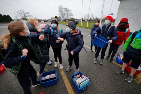 Children from 3rd  Class at Scoil Oilibheir Naofa, Primary School in Kilcloon, Co Meath, meet up on the first day back returning to school after the Christmas break. Photograph: Alan Betson/The Irish Times


