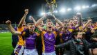 Shane Cunningham and the rest of the Crokes panel celebrate with the trophy. Photograph: Ryan Byrne/Inpho