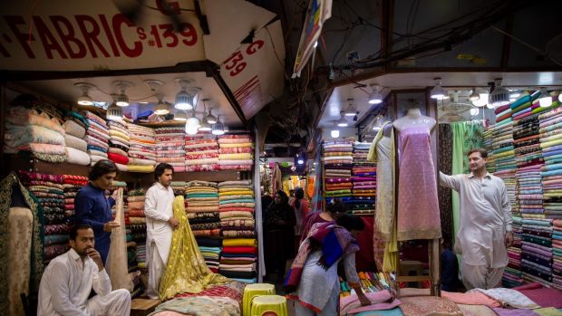 A clothing market where Afghan Talibs own shops, in Karachi, Pakistan. Photograph: Saiyna Bashir/The New York Times