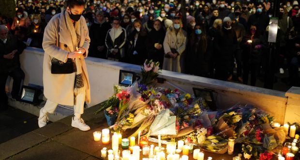 Floral tributes and candles are left after a vigil outside the London Irish Centre in Camden, London. Photograph: Dominic Lipinski/PA Wire