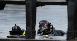 Members of the Garda water unit search a section of the Grand Canal in Tullamore, Co Offaly. Photograph: PA 