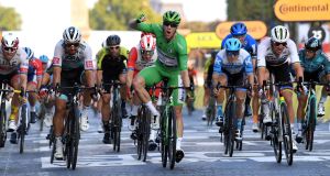 Sam Bennett celebrates winning the green jersey at the 2020 Tour de France finale in  Paris. Photograph: Faugere Franck/Inpho