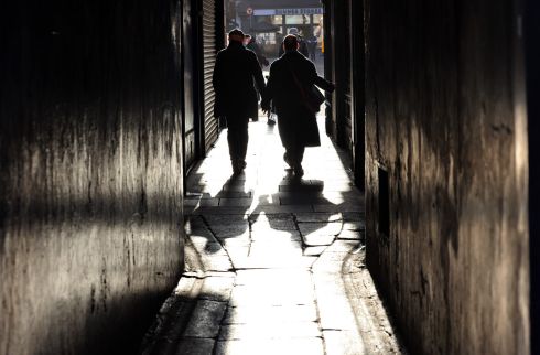 JANUARY RAYS: People walk hand-in-hand through Dame Court, Dublin on a bright Sunday morning. Photograph: Dara Mac Dónaill
