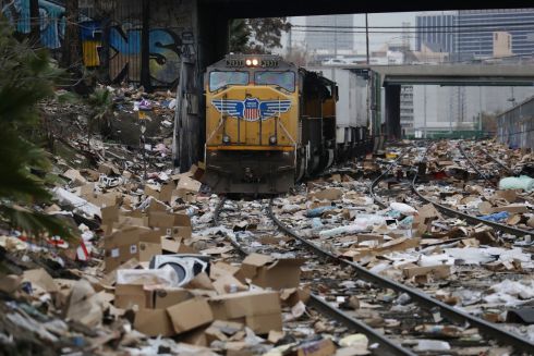 DELIVERY POSTPONED: Thousands of discared opened packages litter train tracks after they were looted from a Union Pacific train which was hauling Fed Ex, Amazon, UPS and other box cars through the Lincoln Heights area of Los Angeles, California, US. Photograph: David Swanson/EPA
